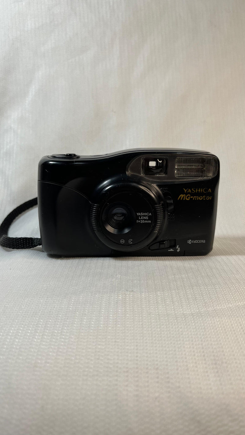 Câmera Fotográfica Analógica
 Yashica MG-motor