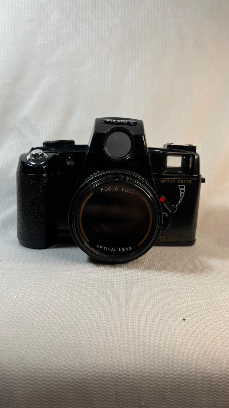 Câmera Fotográfica Analógica
 Sony Analógica Motor Drive com HandGrip e Flash